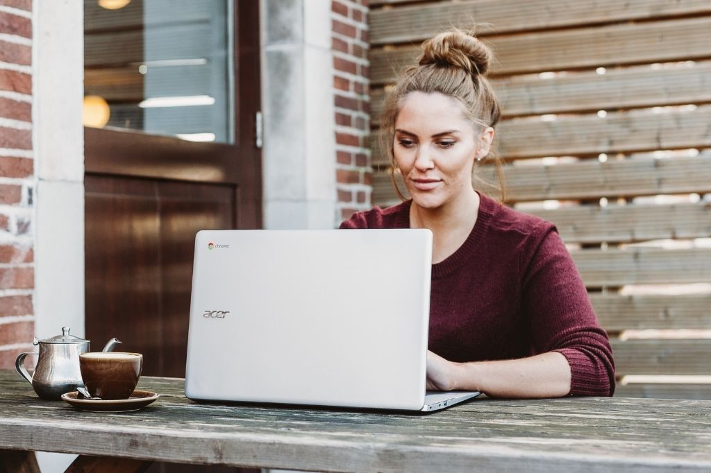 woman sitting at a desk using an Acer Chromebook