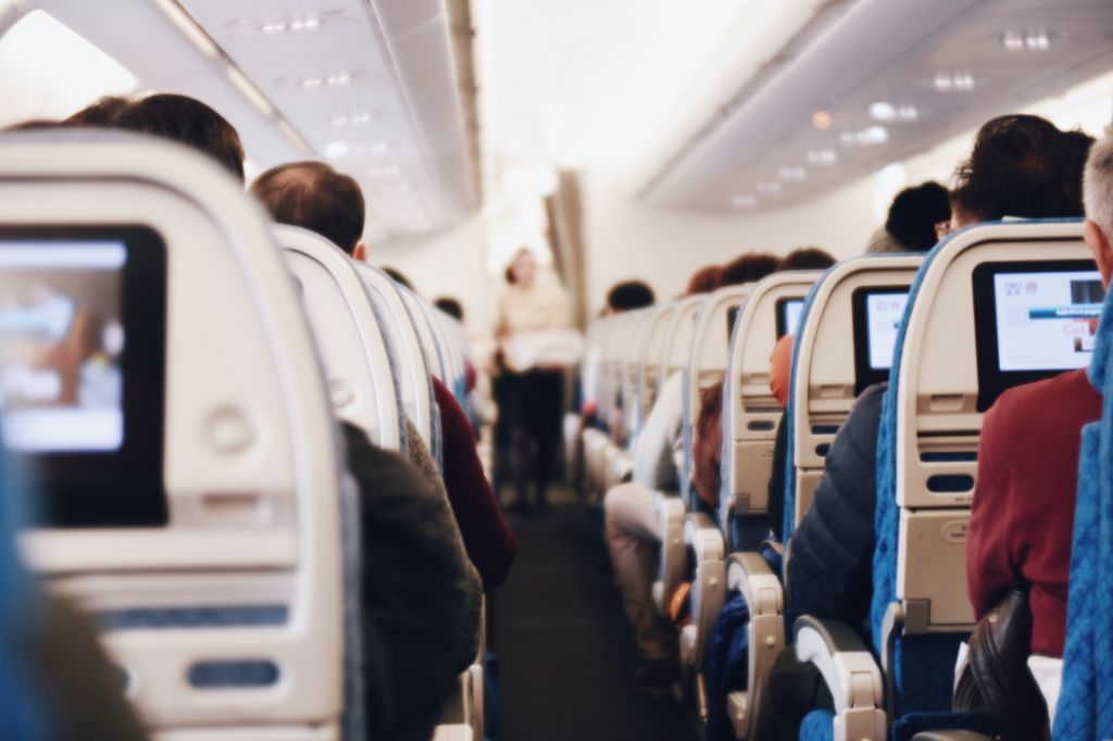 image of people sitting inside an airplane