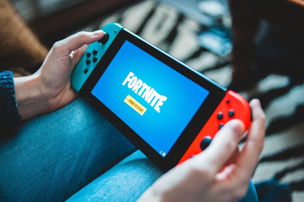 a person playing Fortnite on a Nintendo Switch gaming console