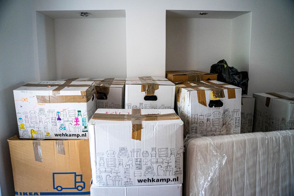 image of a room containing boxes and storage bins